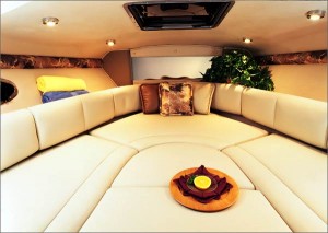 Shown with the cushions in place, a dinette berth becomes a large V-berth for sleeping or relaxing in the cabin. (Photo courtesy Chaparral Boats)