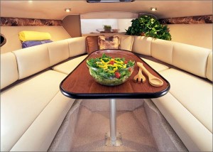 Without the berth cushions in place, a dinette berth functions as a dining table and seating area. (Photo courtesy Chaparral Boats)
