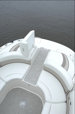 The sun pad flips up to allow for a center stern walk-through.