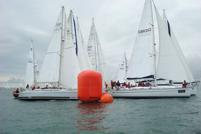 A crowded mark rounding in light air.