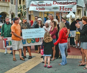 Bob Barnhart presents Jennifer Molter with a check