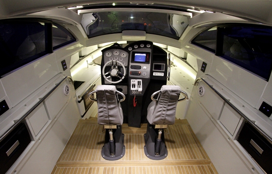 The cockpit enclosure has a full-time hardtop overhead, but also includes a sunroof and power windows.