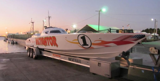 A canopied V-bottom called Instigator comes out of the water—no crane required—in the wet pits.