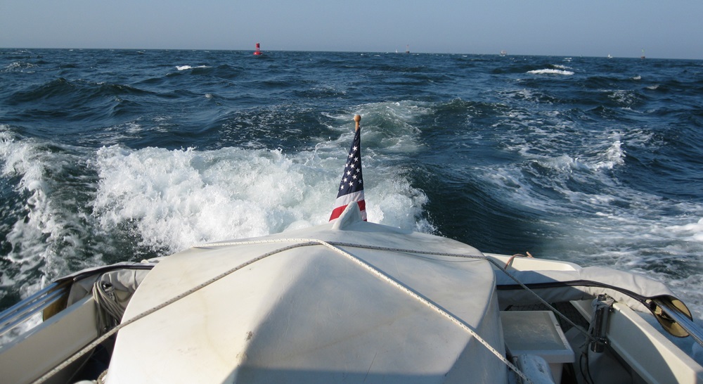 hard-dinghy-2 For long passages or rough water we haul the dinghy aboard over a doormat and lash it down.