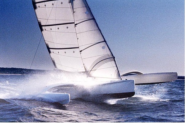 The 40-foot Ocean Surfer, designed by Dick Newick for Mark Rudiger and the 1988 CSTAR. Note the battens and internal wishbone in the jib, and the graceful arc of the akas. Credit: Newick website.