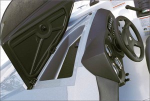 A solid wind faring on each side of the dash flips up to reveal a stowage compartment.