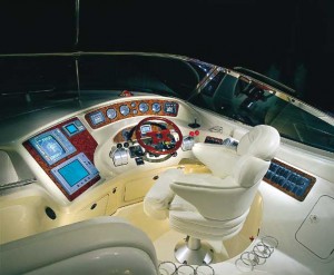 In addition to backlit instrumentation, the helm of the 510 Sundancer features Raytheon navigation equipment, a woodgrain steering wheel and hydraulic shift and throttle controls.