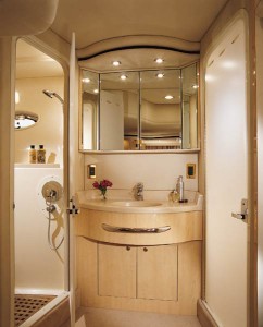 In addition to a stand-up shower, the forward head has private access to the master stateroom. 