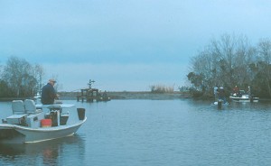 Boats crowd the end of a pipeline canal hunting reds and specks.