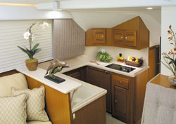 The galley — located a step down, just forward of amidships — is packed with all the amenities of home, including Corian countertops.