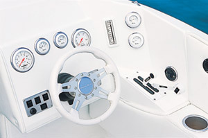 At the helm to starboard, the dash featured an array of Gaffrig gauges in gray bezels arranged around a tilt steering wheel.