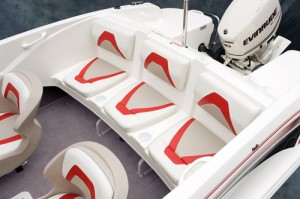 Individual rear-seat cushions are placed on a base molded as part of the fiberglass deck. Plastic braces below the seat are notched to double as a board rack.
