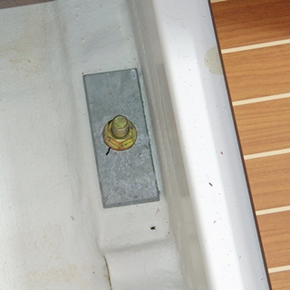 There should be a lock-washer under the nut on this keel bolt, not just a flat washer.