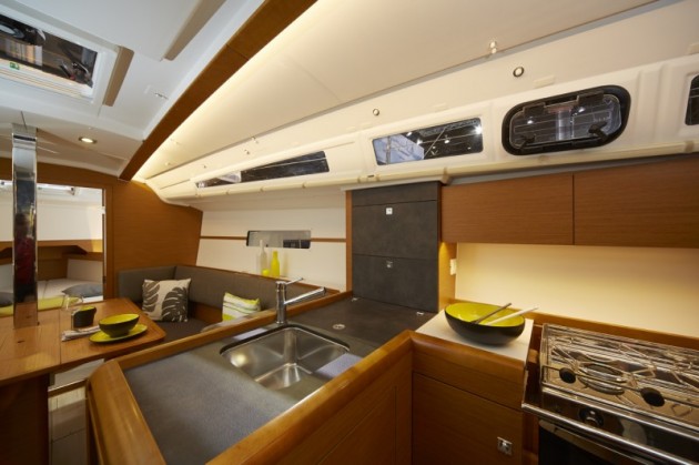 A photo of the main saloon and galley on the Jeanneau Sun Odyssey 349.