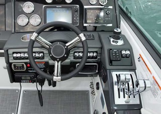 The helm station on the 330 CBR features chrome shifter/throttles, Livorsi Marine gauges, and a Garmin 547 color GPS/plotter.