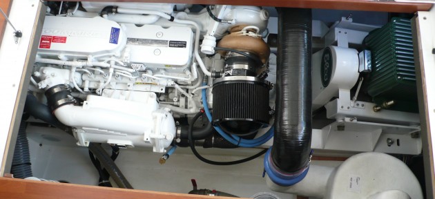 A six-cylinder, 425-horsepower Cummins turbo diesel not only powers the propeller that pushes the Beneteau Swift Trawler 34 through the water, it also spins the Elco electric motor (right) to generate power that charges the hybrid battery bank.