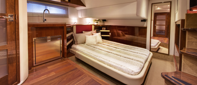 The mid-cabin master stateroom on the Four Winns H440 is open concept, meaning it flows right into the main salon, and vice versa.