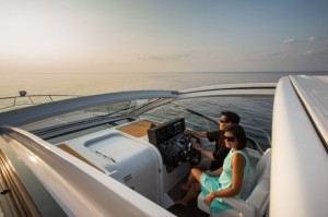A n electrically operated sun shade provides convertibility to the main deck space on the Cruisers Yachts 390 EC. 