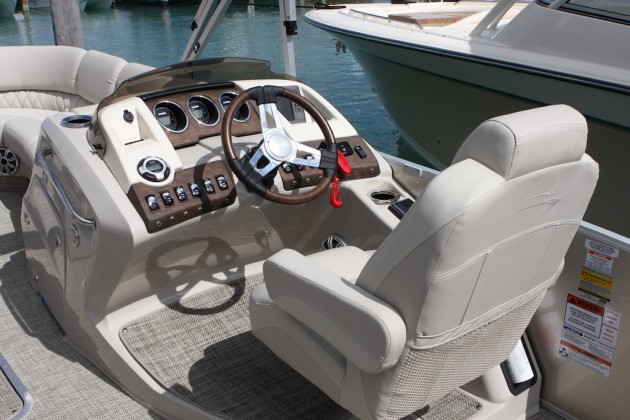 Constructed of solid fiberglass, the helm console provides an elevated and sturdy platform for the plush captain's chair, as well as room for stowage, beneath. 