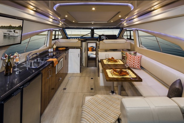Carver has always had a knack for making the most out of every inch of space on its boats, and that skill is apparent in the roomy main salon. Note the overhead opening sunroof, covered by a sunshade in the photo. Photo courtesy of Carver