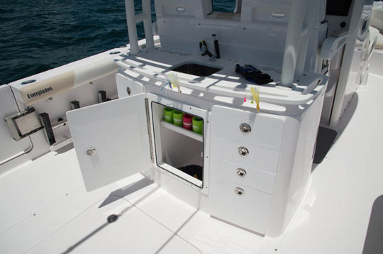 Behind the helm seating is a rigging station we challenge you to fill with tackle. It’s massive, having more drawers and cubbies than most folks will know what to do with, as well as a sink, cutting area, and tons of places for tools.