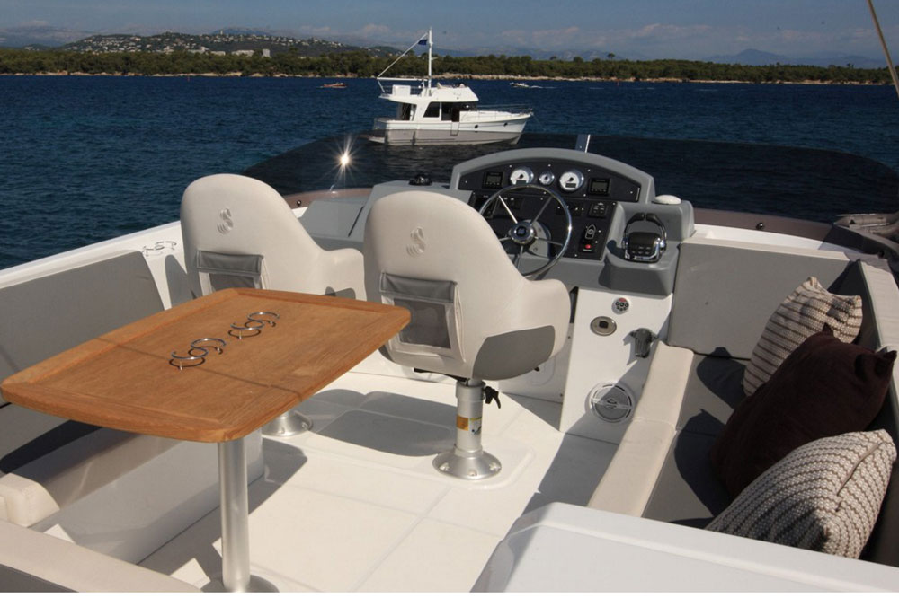 The flybridge is accessed via a set of teak steps from the aft cockpit, and is roomier than one might expect.