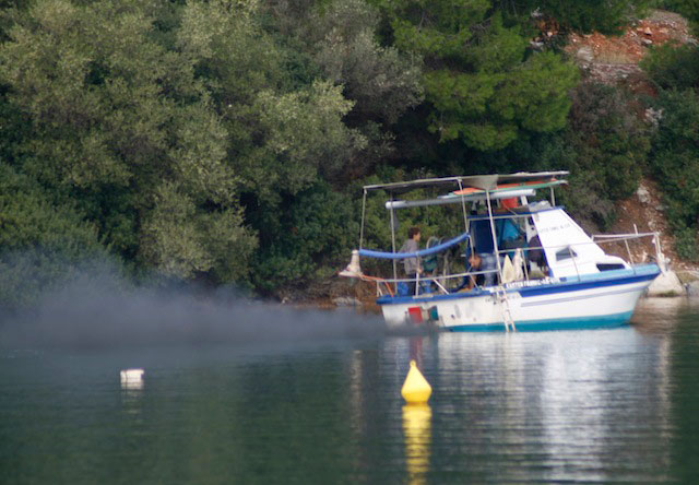 This boat has a bad case of black smoke, a sure sign of excess, partially combusted fuel. It may take some detective work to figure out the cause.