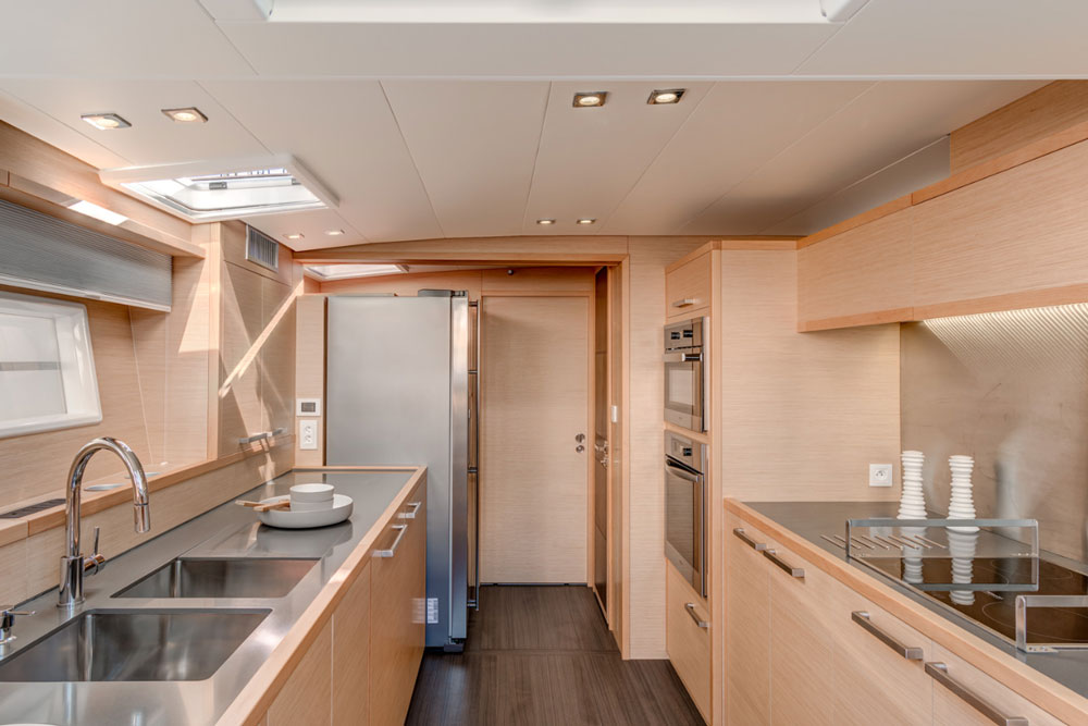 A full-sized refrigerator and oven and a double sink are a few of the perks chefs will enjoy, thanks to the spaciousness of the galley in the 630 Motor Yacht.