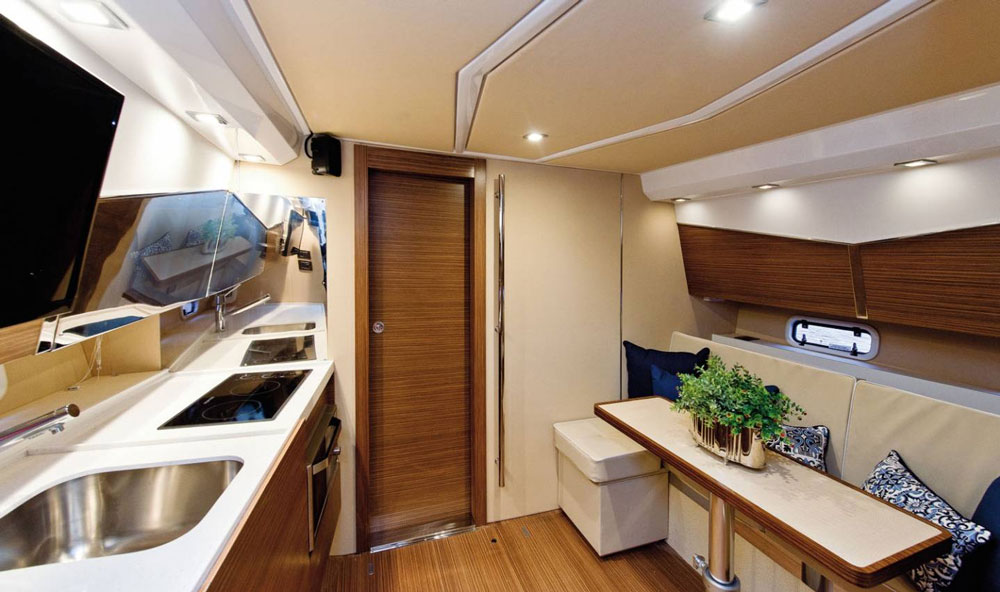 Caneletto walnut finish, Montblanc (white) Silestone countertops and generous use of soft spotlights raise the bar on how chic a walkaround weekender can be.