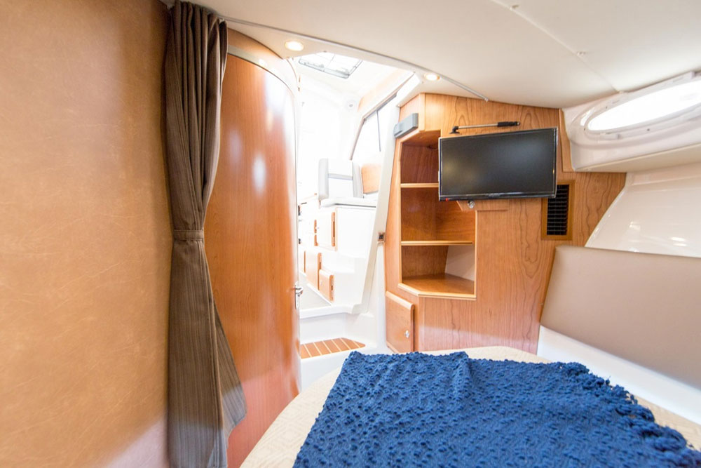 The master staterooms/cabins are situated forward on both boats. Naturally, on the C-302 (seen here) there’s notably more room.