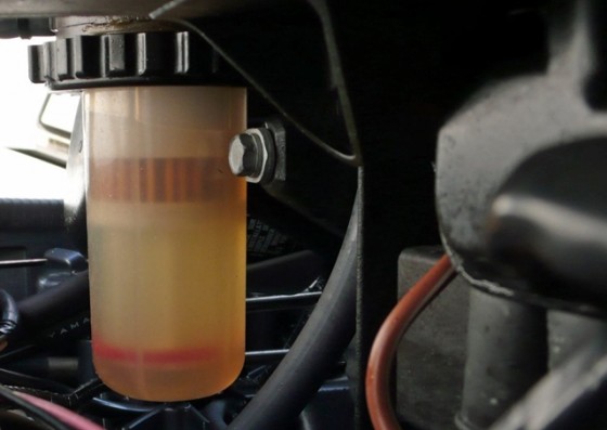 An engine-side canister with a filter and a water sump is the last line of defense before water works its way into the engine.
