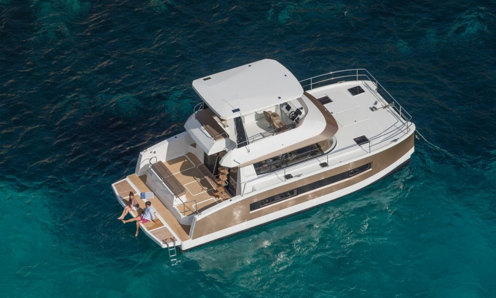 skater adapting large catamarans for outboard power